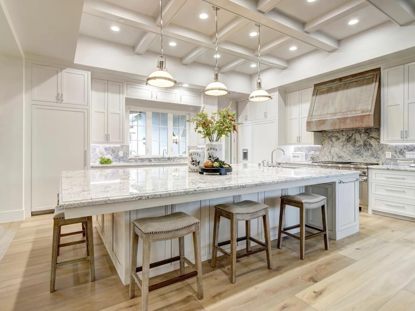 Gourmet kitchen Granite Bay luxury home - white cabinetry marble countertops