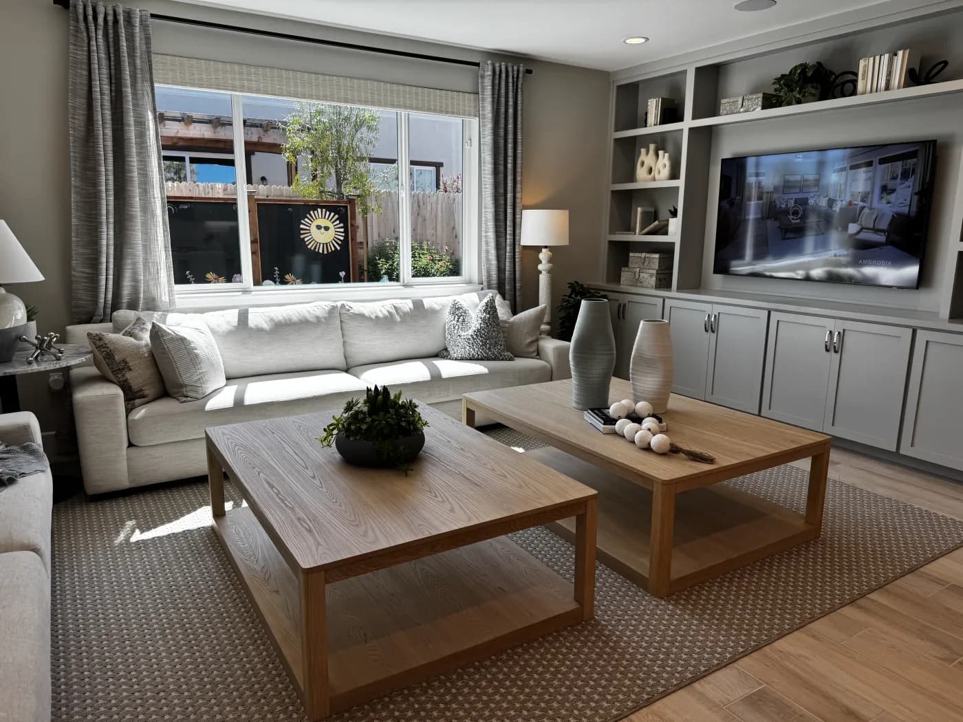 Family room at Amoruso Ranch with built-in entertainment cabinetry and sectional seating
